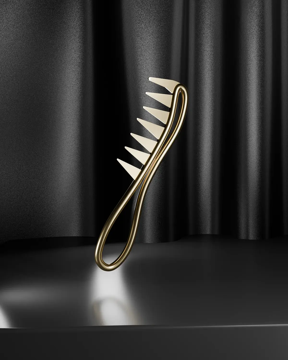 The Gold HEEM Comb floating in front of a dark curtain